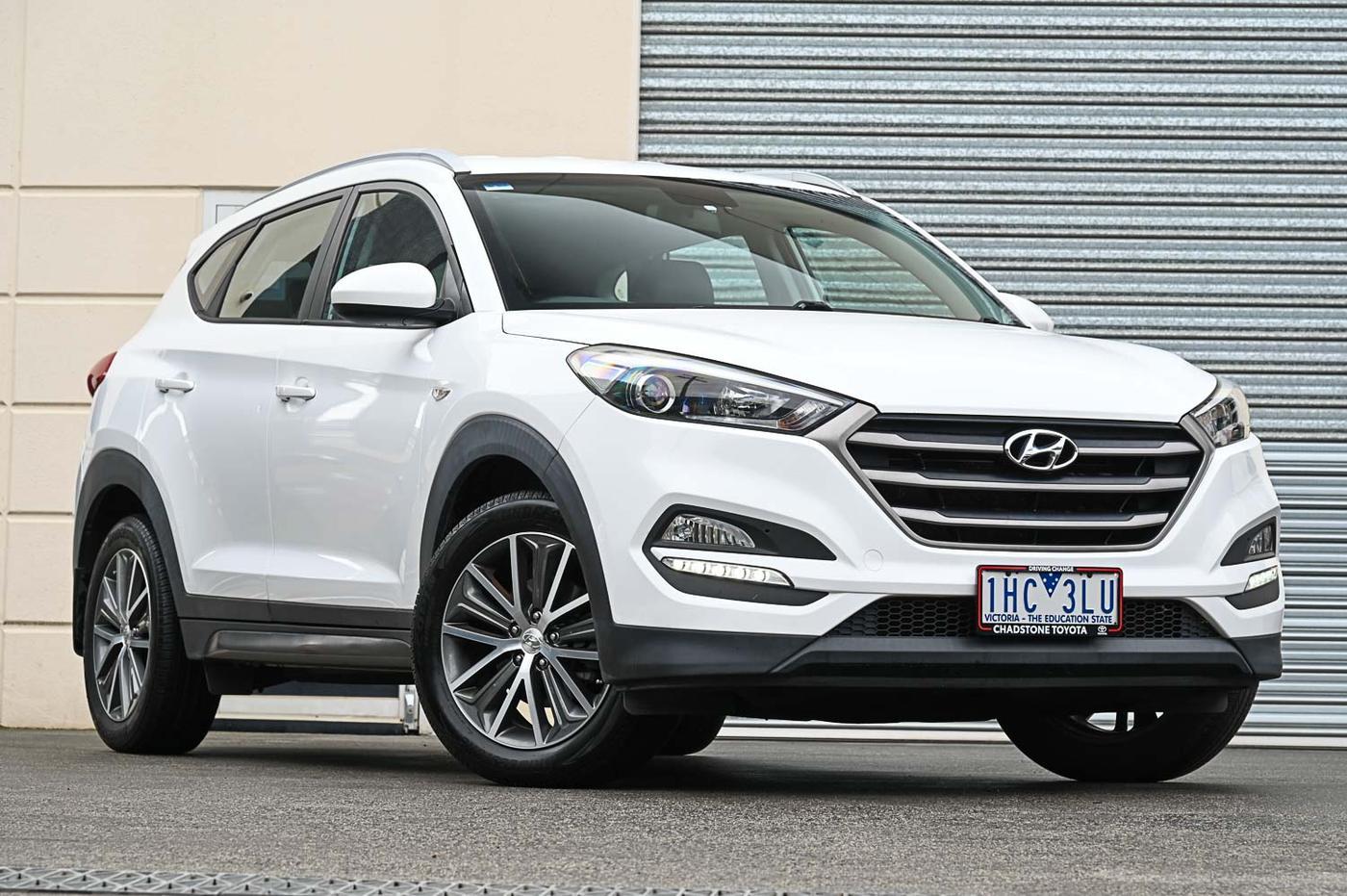 Hyundai Tucson Active X in white — front three-quarter view at the Ripper Cars showroom in Springvale