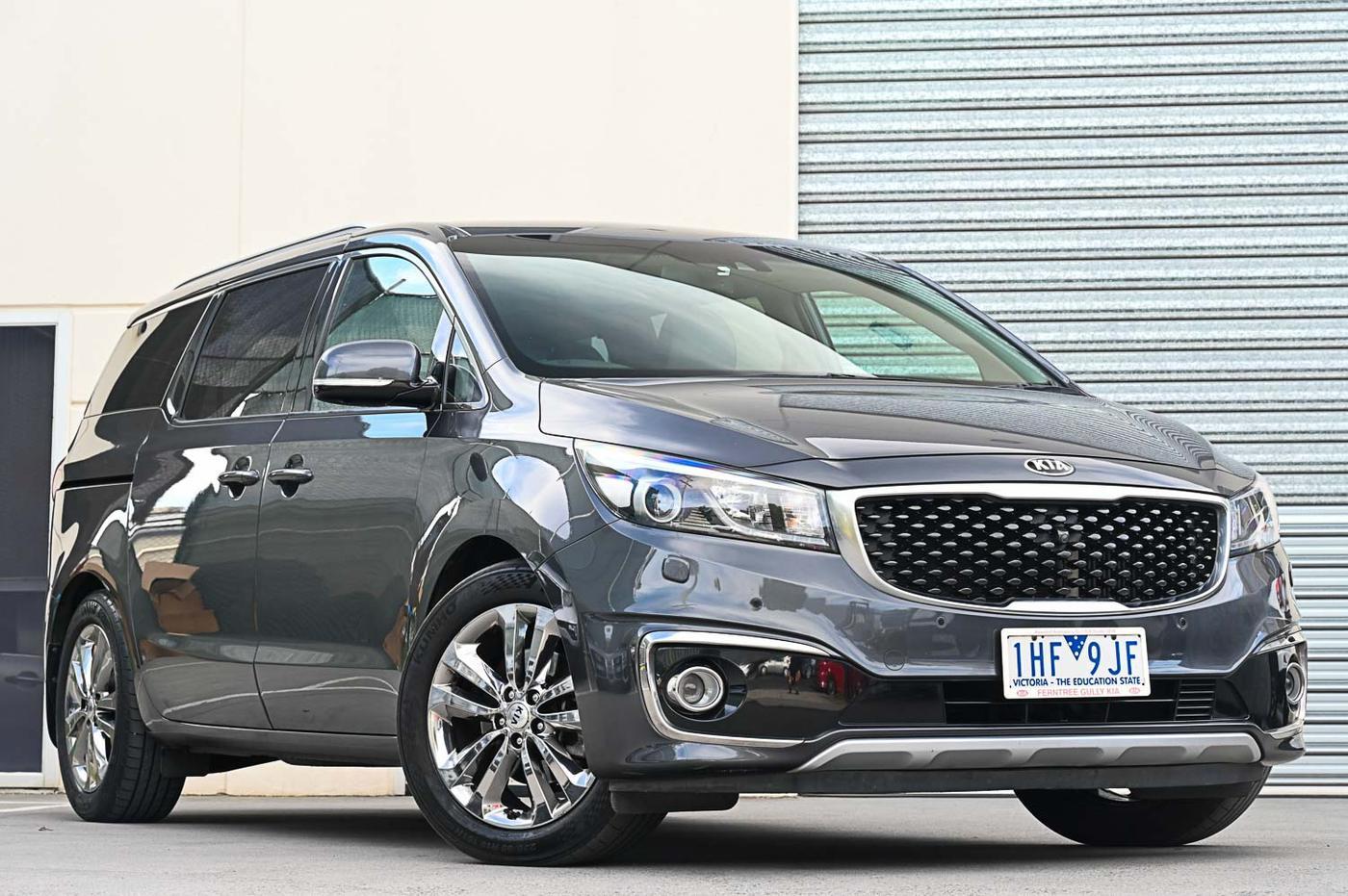 Kia Carnival Platinum CRDi in charcoal — front three-quarter view at the Ripper Cars showroom in Springvale