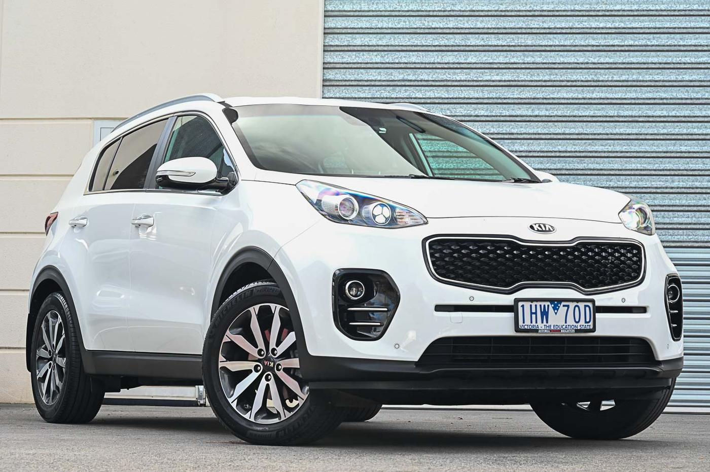 Kia Sportage in white — front three-quarter view at the Ripper Cars showroom in Springvale