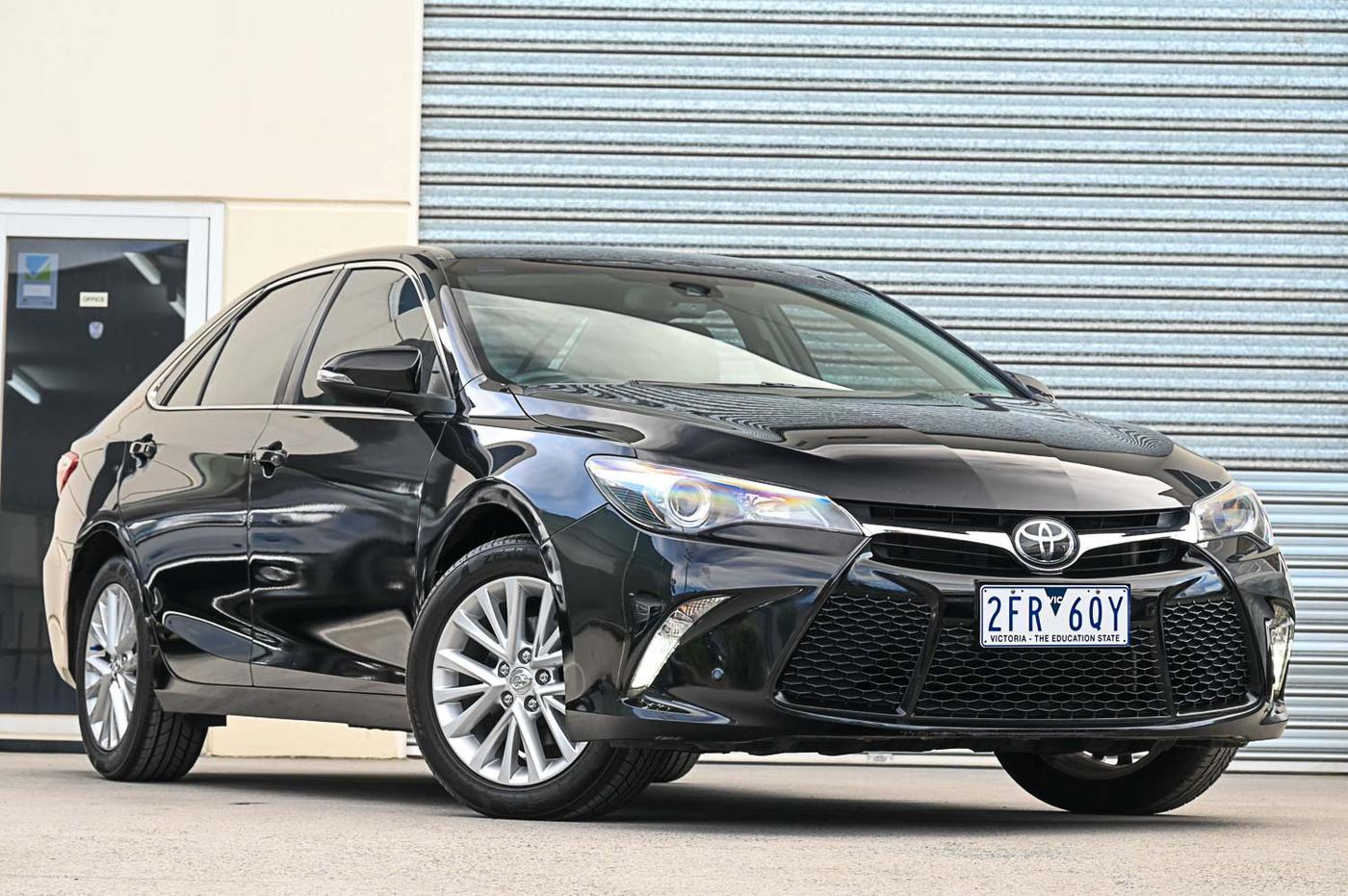 Toyota Camry Atara SL in black — front three-quarter view at the Ripper Cars showroom in Springvale