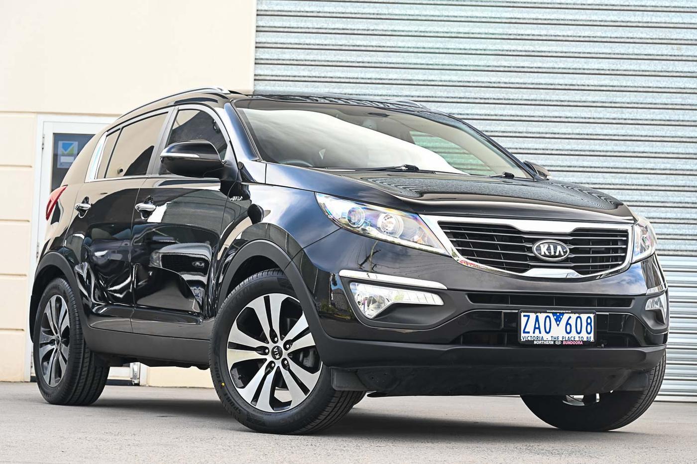 Kia Sportage Platinum AWD in black — front three-quarter view at the Ripper Cars showroom in Springvale